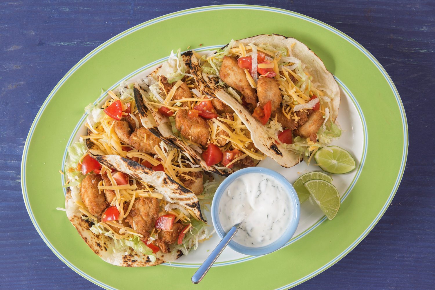 Crispy Chicken Tacos with CilantroSour Cream Sauce